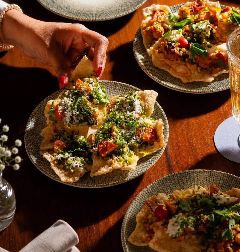 Colorful Indian-inspired plates set out to share